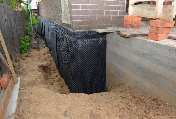 Happy homeowners after waterproofing job in Dadeville